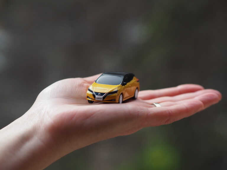 Miniature EV in palm of hand