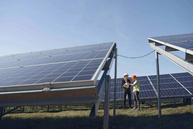 Solar farm with workers